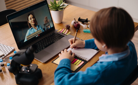 online-learning-using-laptop-teacher-and-boy